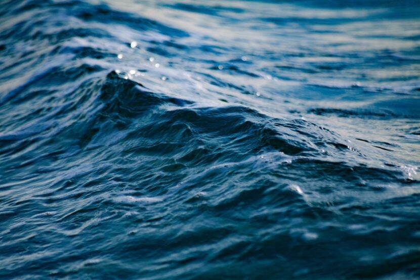 A close up of ripples on blue ocean water